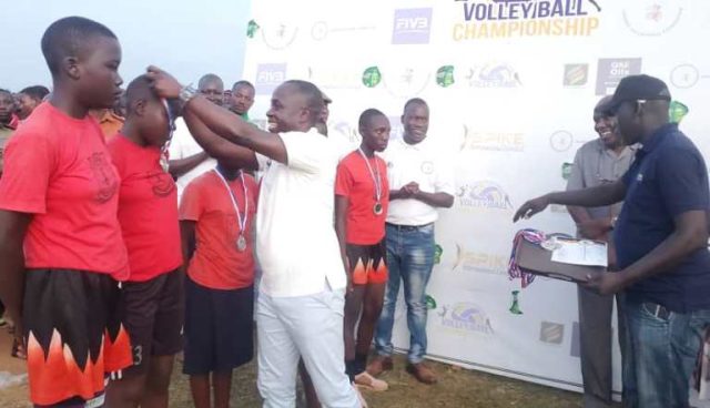 Minister Ogwang decorating winners