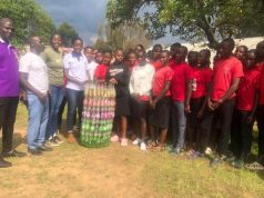 PICTORIAL! Bwambara Leo’s Club members clean Bikurungu Town in bid to protect the Environment