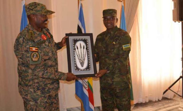 Lt Gen Kayanja Muhanga and Maj Gen Vincent Nyakarundi exchange gifts