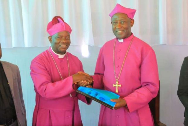 Kaziimba Mugalu with the Bishop of West Ruwenzori Diocese Bishop Rt Rev Barnabas Tibaijuka