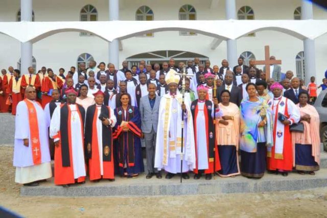 Mugalu takes a group photo with East Ruwenzori Diocese leaders and other Bishops