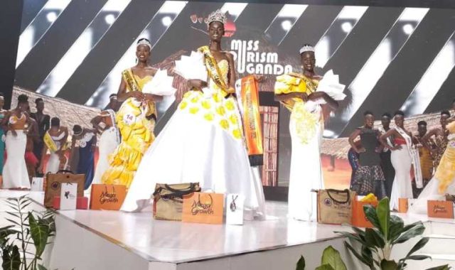 Newly Crowned Miss Tourism Nachap Kezia in the center carrying a bouquet