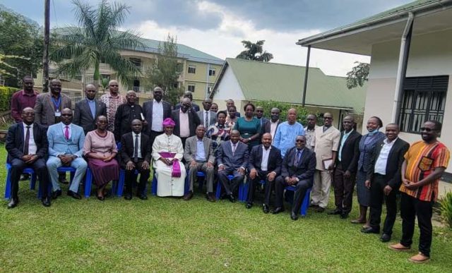 NCHE team led by Dr Alex Kagume pose for a photo with Bishop Zoreka & team