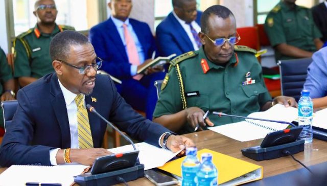 Kiryowa Kiwanuka and the Managing Director of National Enterprise Corporation Lt Gen James Mugira